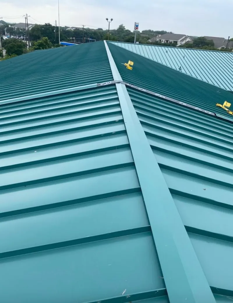 Green commercial metal roof ridge and valley for Metal Roof Repair in Grand Junction